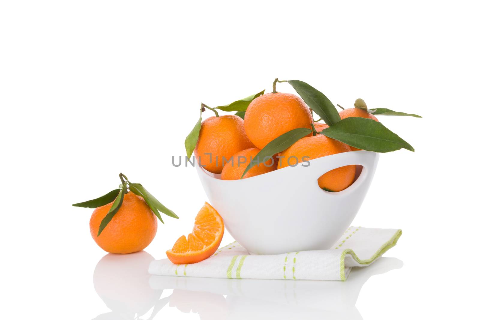Fresh ripe mandarines in white bowl isolated on white background. Healthy fruit eating. 