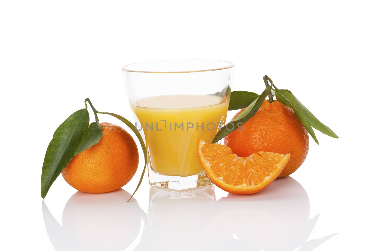 Fresh tangerine juice and ripe mandarin isolated on white background. Healthy fresh fruit juice.