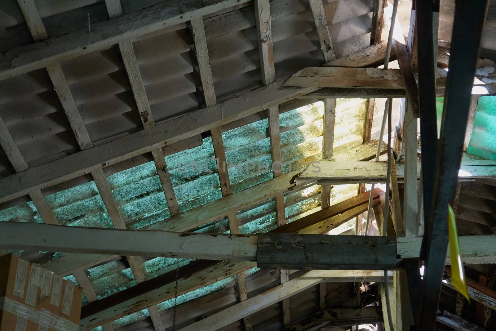 Old damaged roof ceiling of a vintage abandoned house 