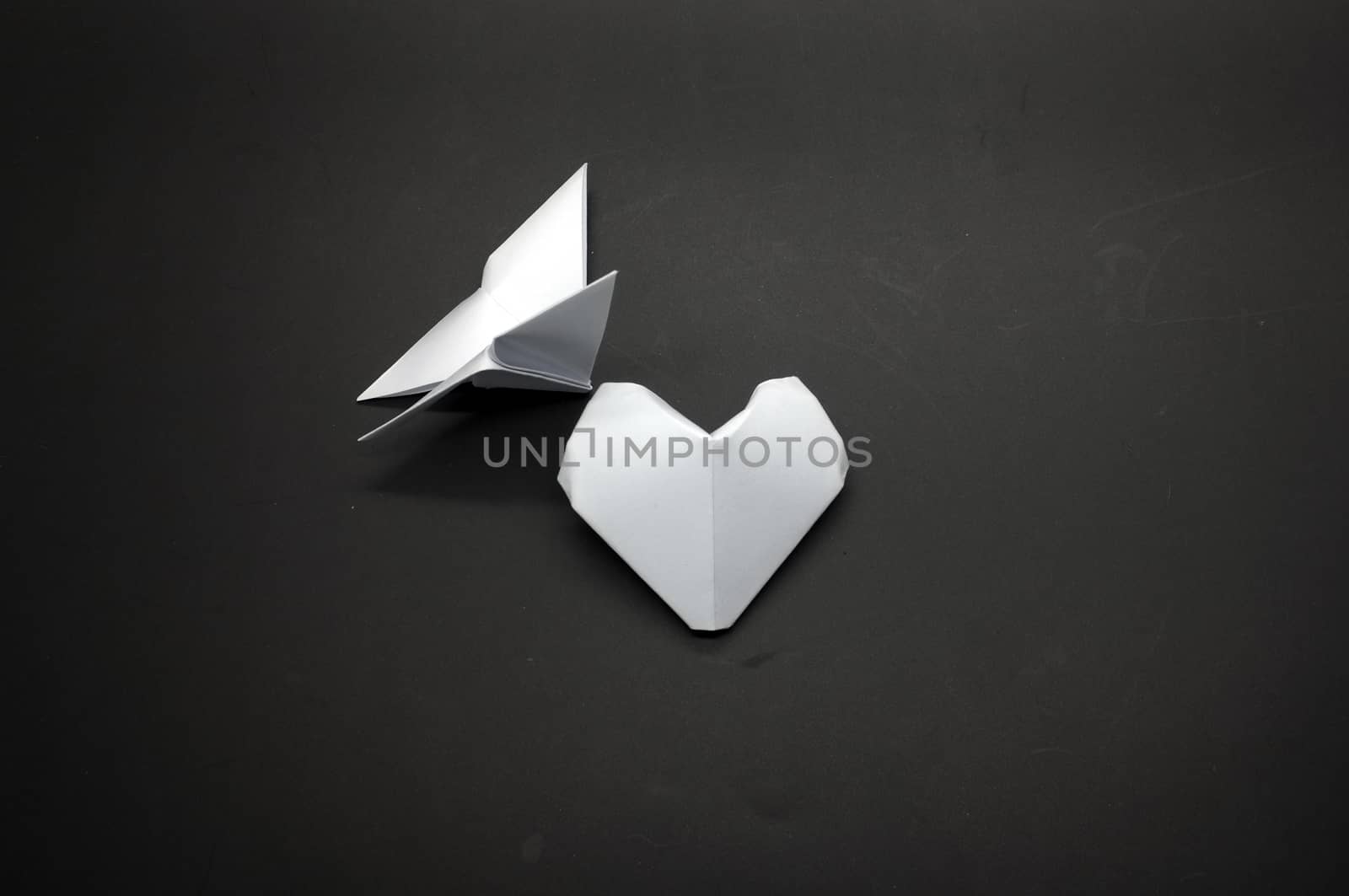 White origami butterfly and heart shape paper by Hepjam