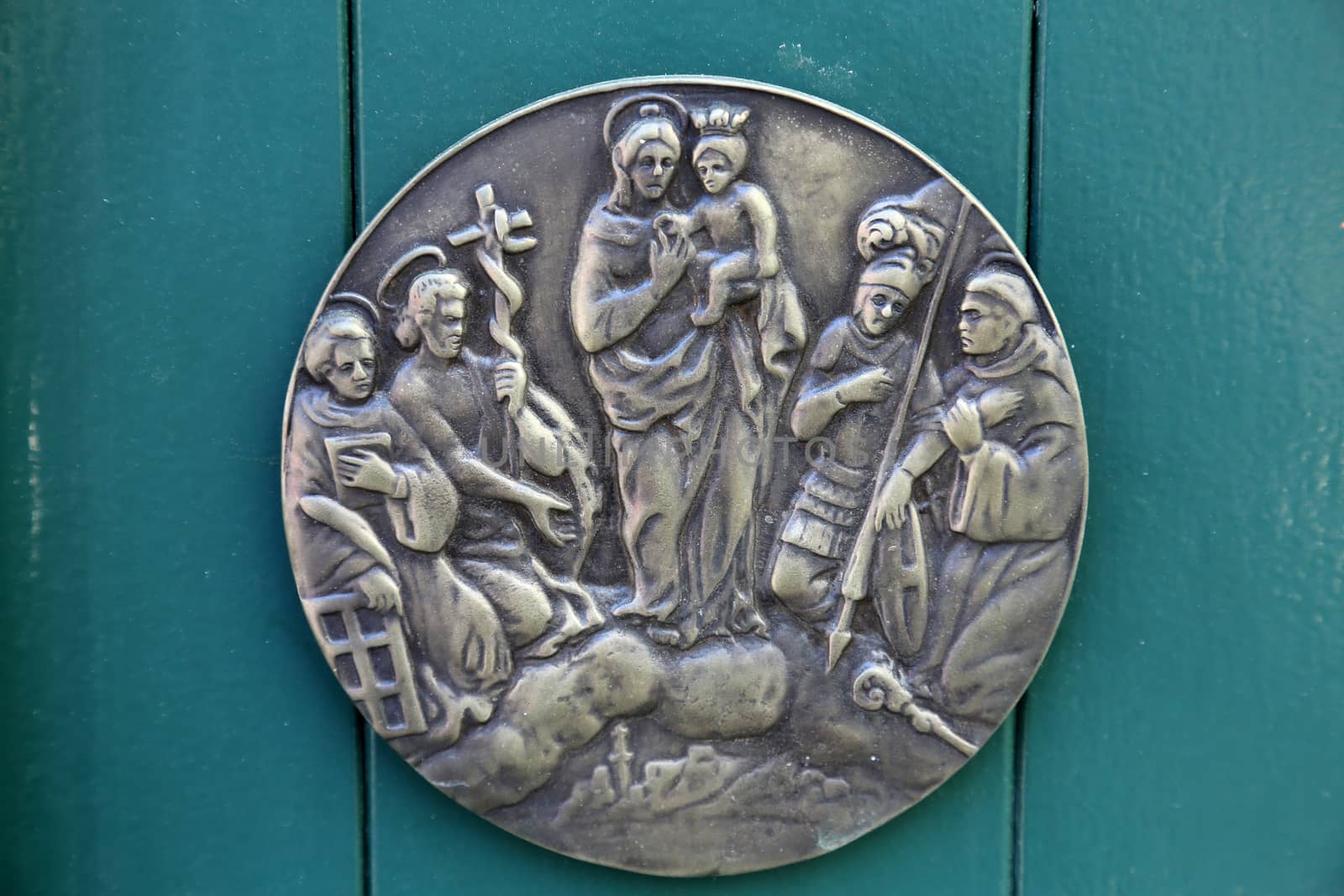 Virgin Mary with Baby Jesus and Saints, relief at home in Portofino, Italy