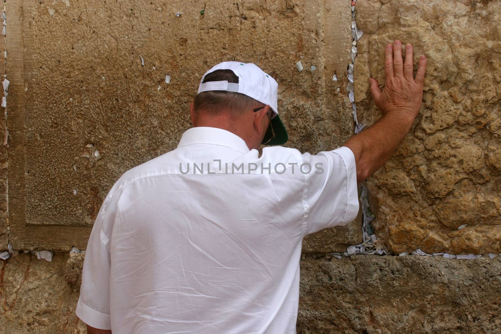 Jewish men pray at the western wall October 03, 2006 in Jerusalem, IL. The wall is one of the holiest sites in Judaism attracting thousands of worshipers daily.