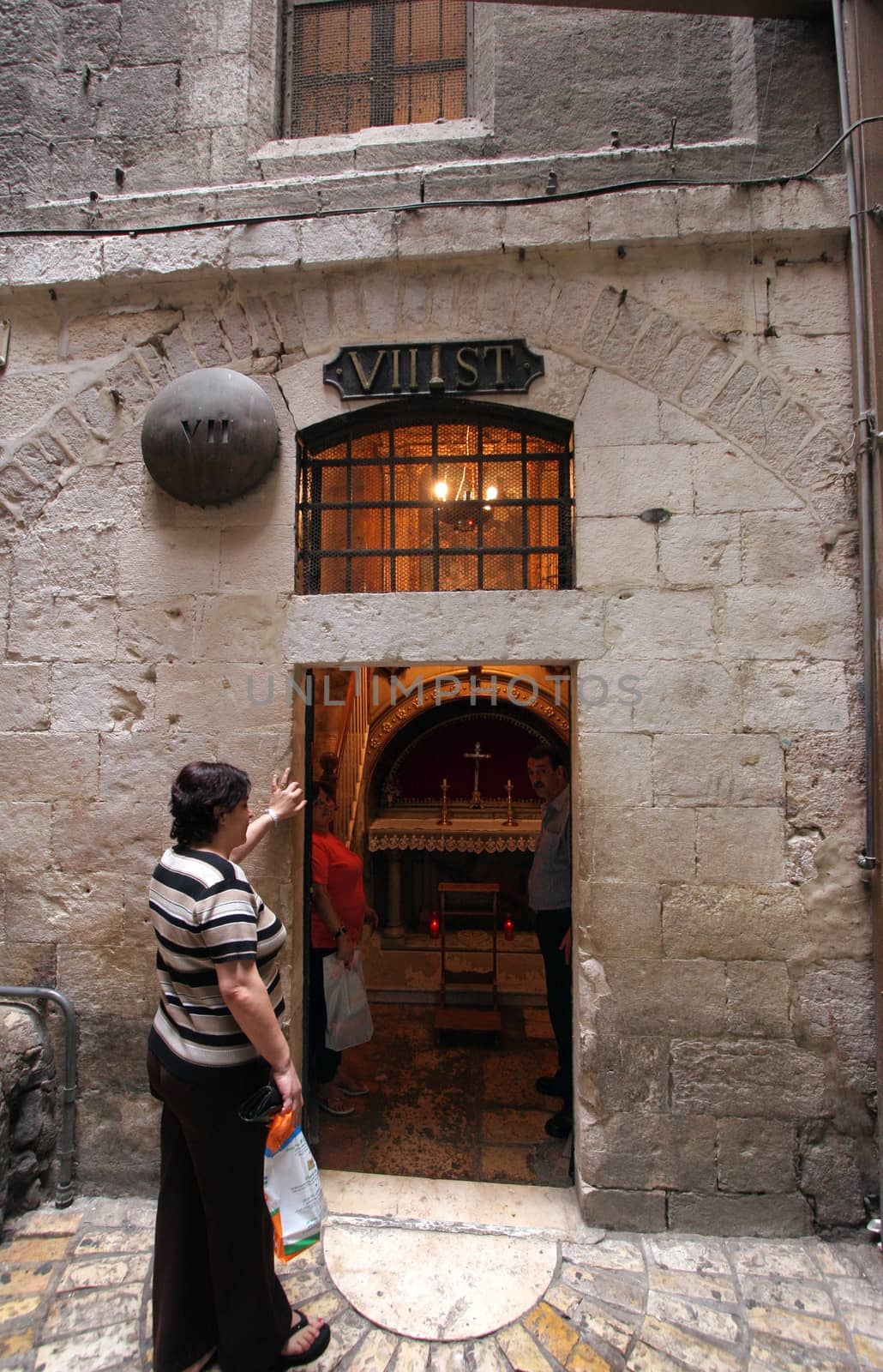 Via Dolorosa, 7th Stations of the Cross. The pilgrims who visit the Holy Land, pass the path that Jesus carried the cross to Calvary. Jerusalem on October 03, 2006.