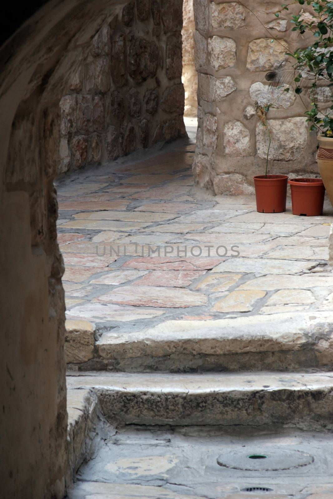 The narrow street in the Old City of Jerusalem. October 03, 2006 in Jerusalem, Israel. Old Jerusalem is one of most sacred towns in the world.