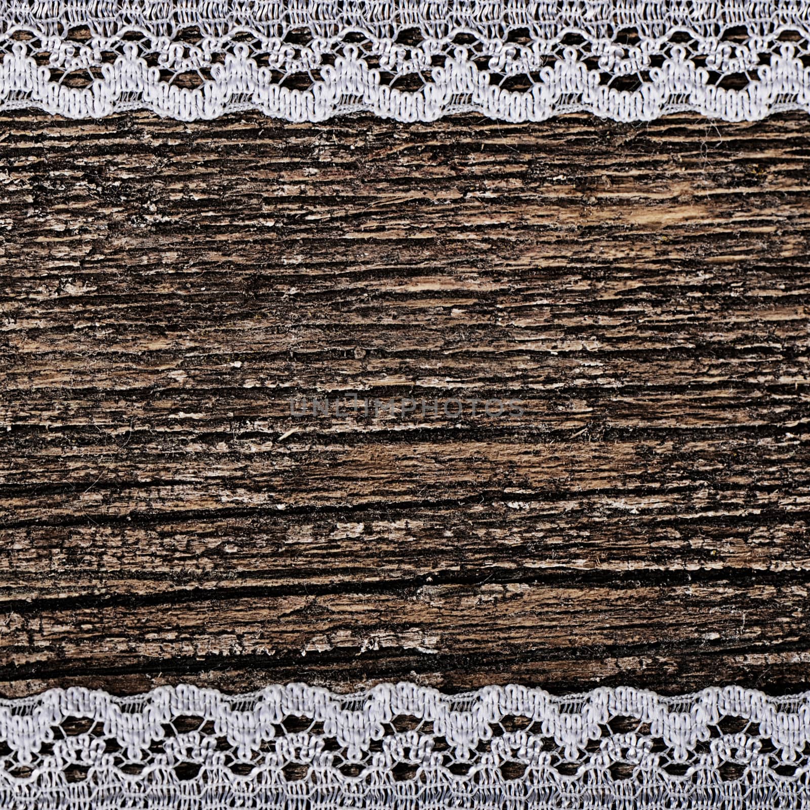The openwork lace on a wooden background