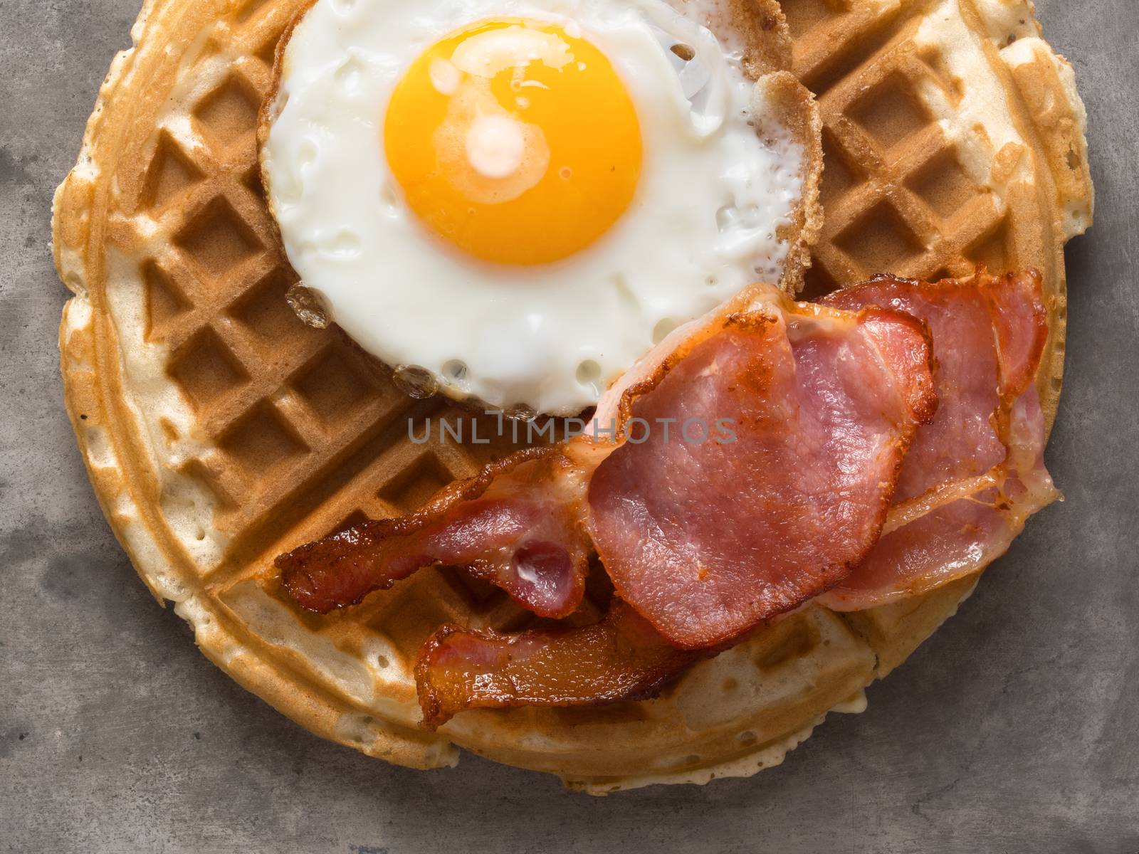 close up of rustic savory bacon and egg waffle