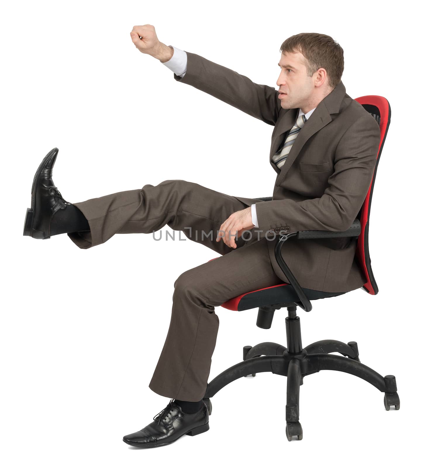 Businessman sitting on chair and kicking space isolated on white background, side view