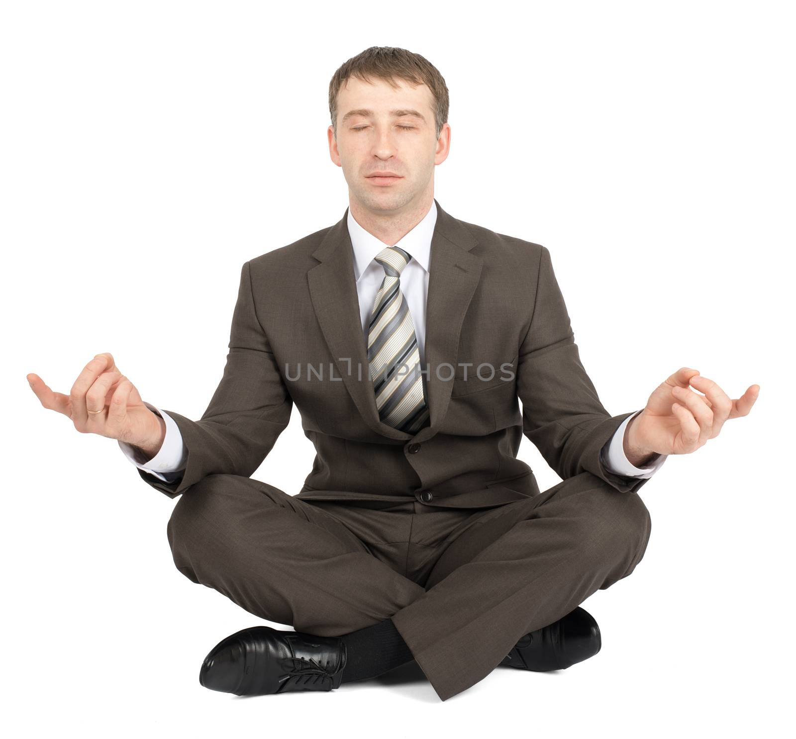 Businessman sitting in lotus posture with closed eyes isolated on white background