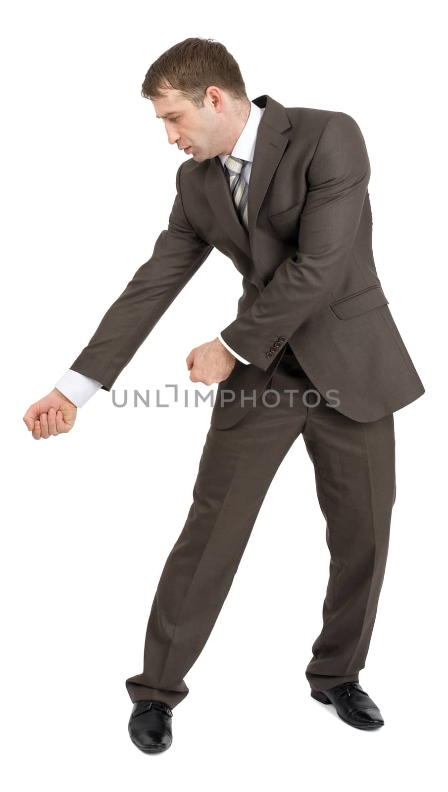 Businessman holding invisible axe isolated on white background, side view