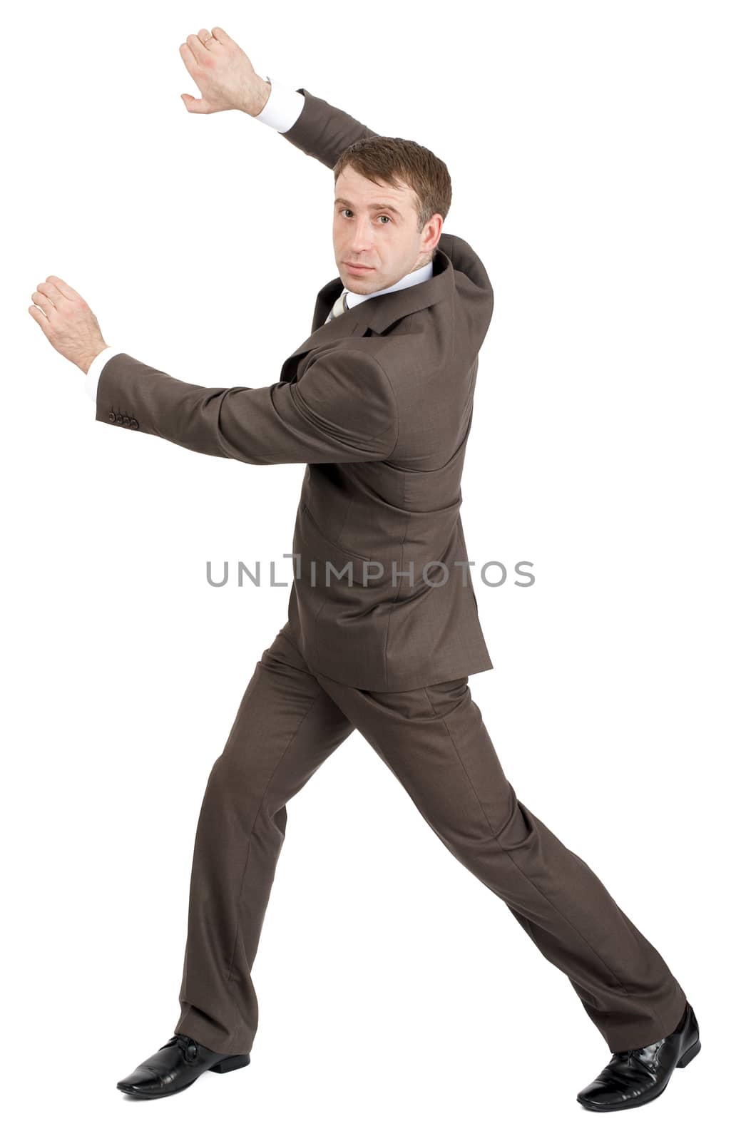 Businessman holding invisible thing by cherezoff