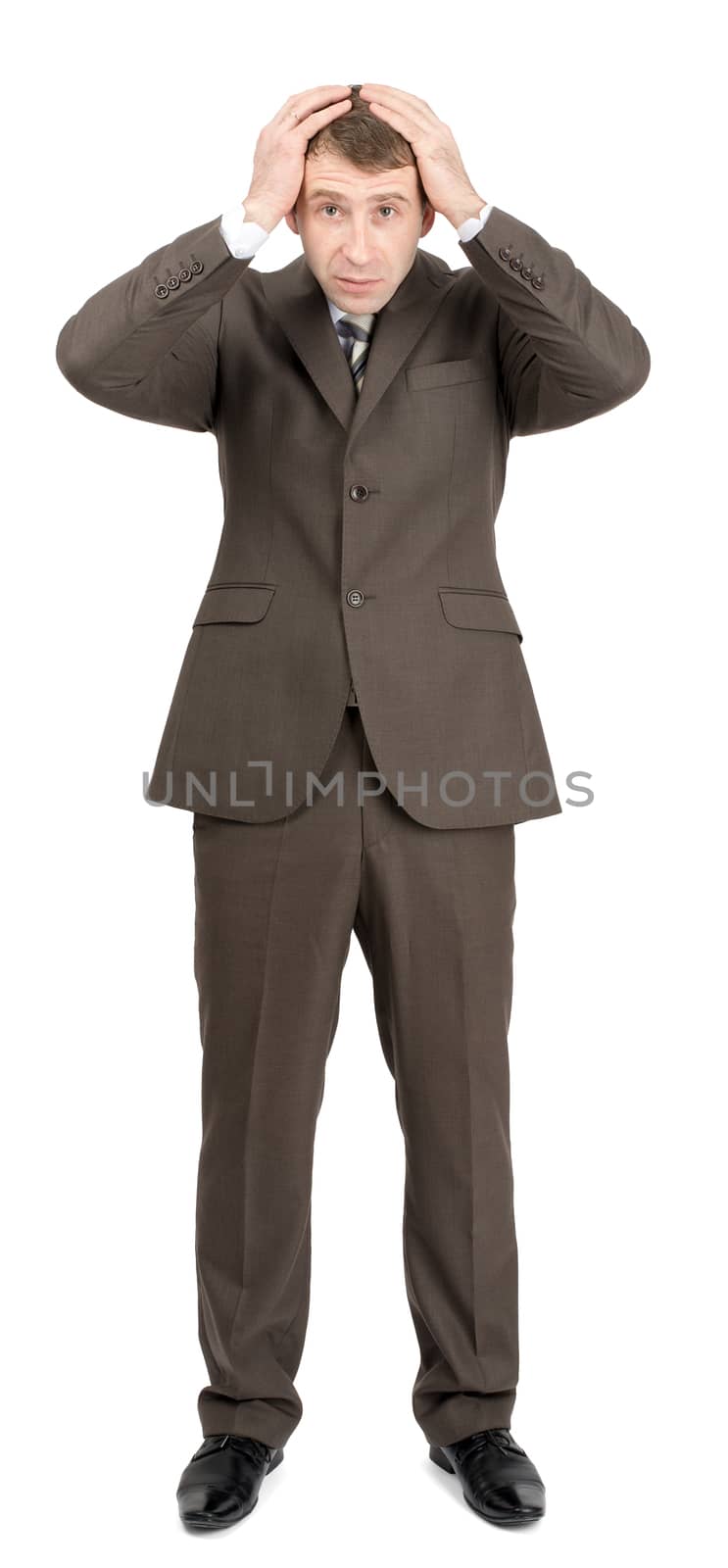 Confused businessman looking at camera isolated on white background