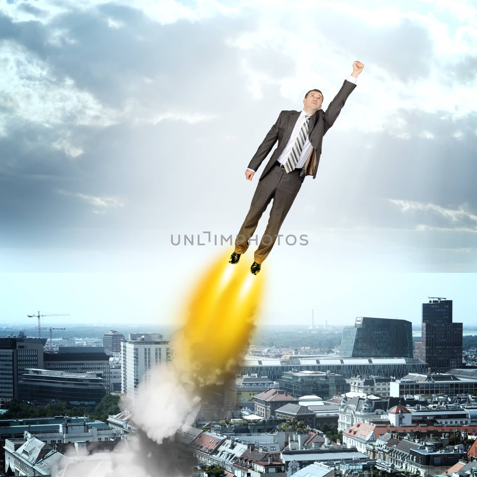 Businessman in suit flying by cherezoff