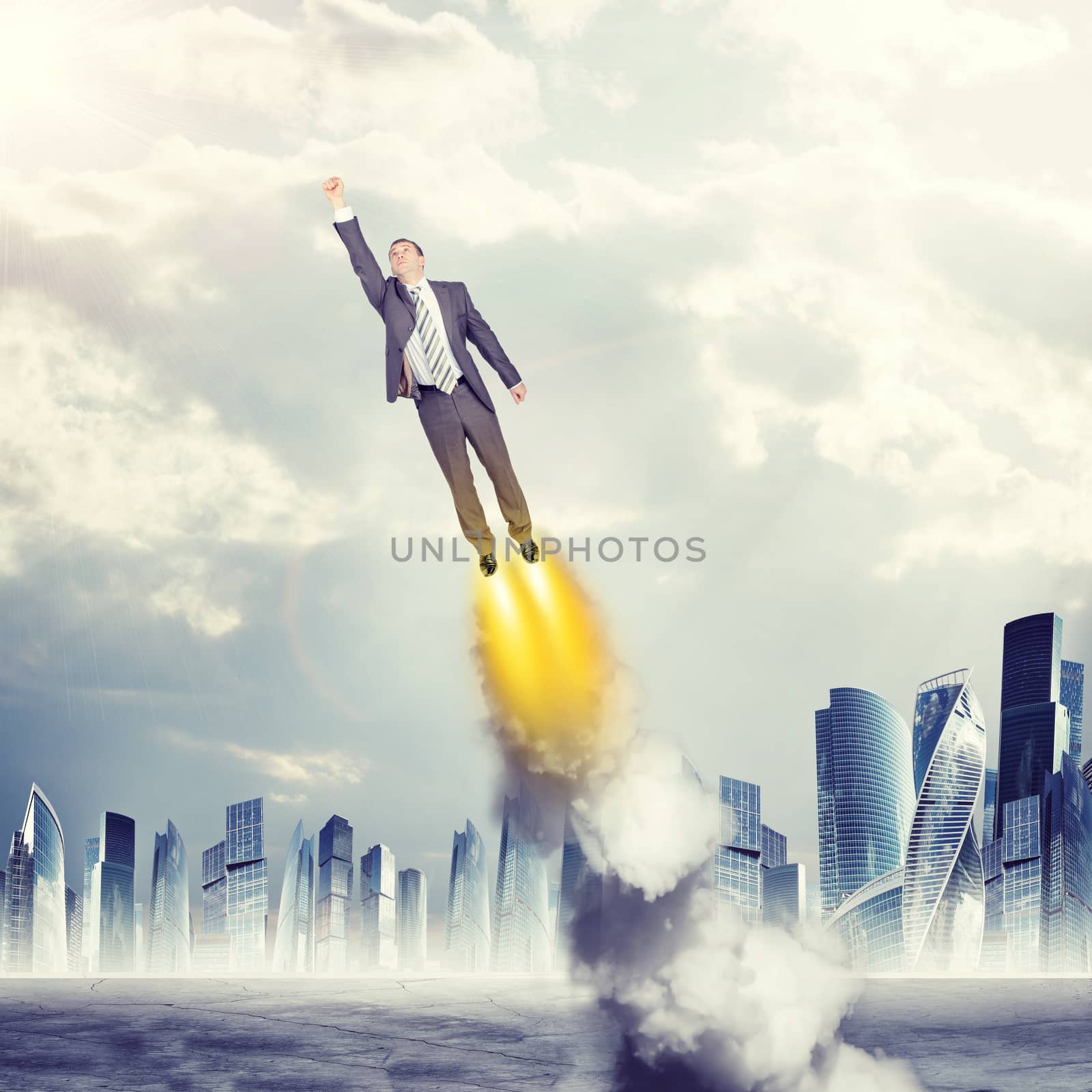 Businessman in suit flying in sky with clouds, front view