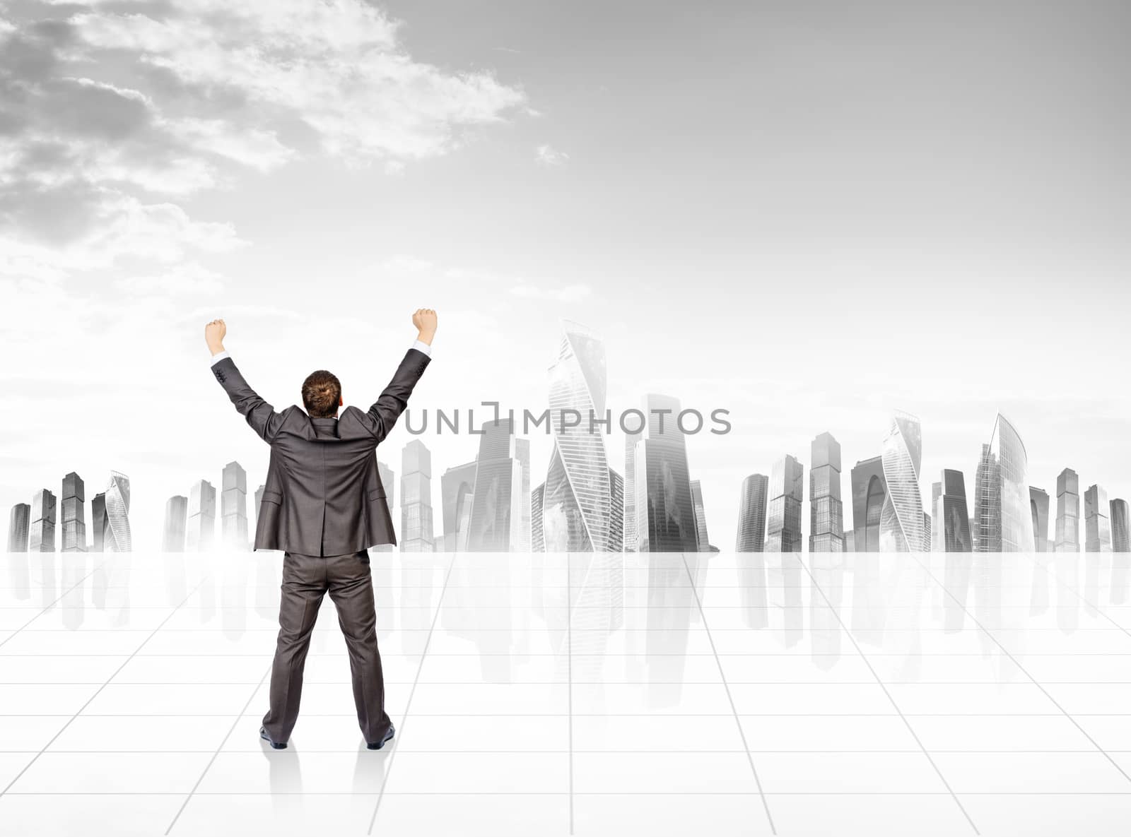 Businessman with spread arms in front of city