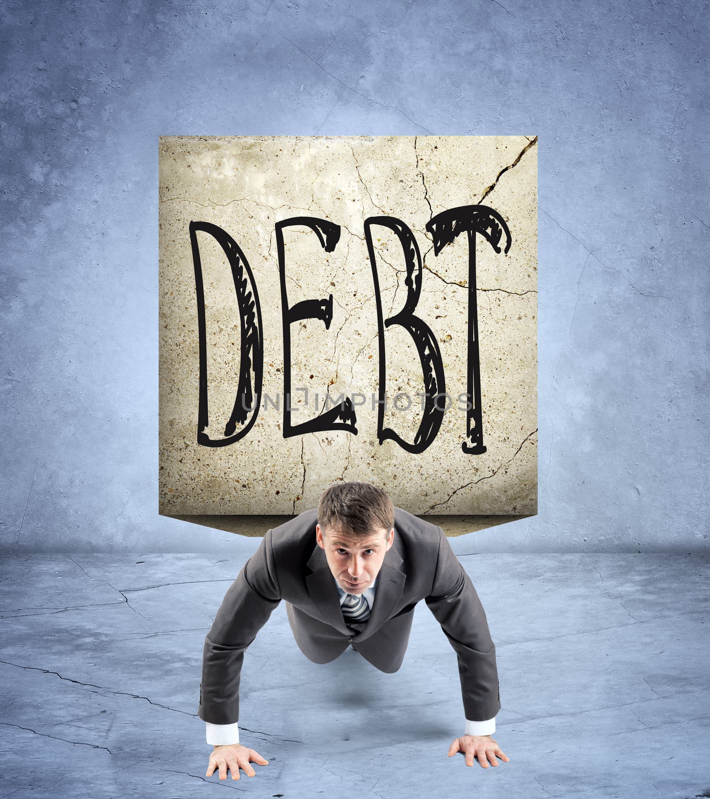 Businessman doing push-ups with stone on back and word debt