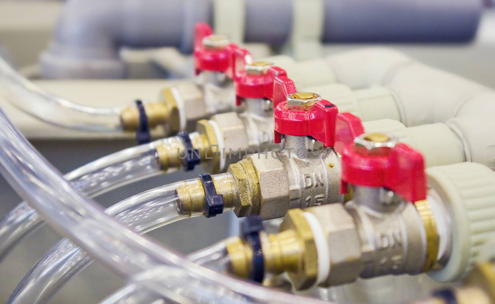 Compact brass distributor with red valves by vrvalerian