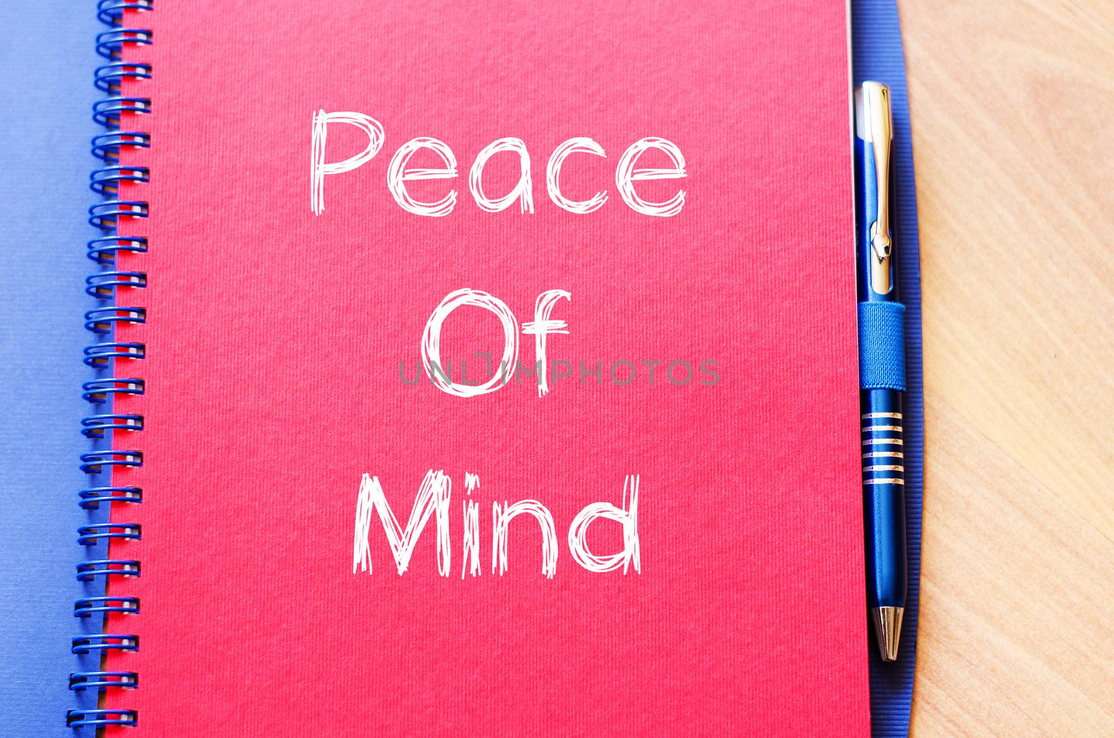 Peace of mind text concept write on notebook with pen