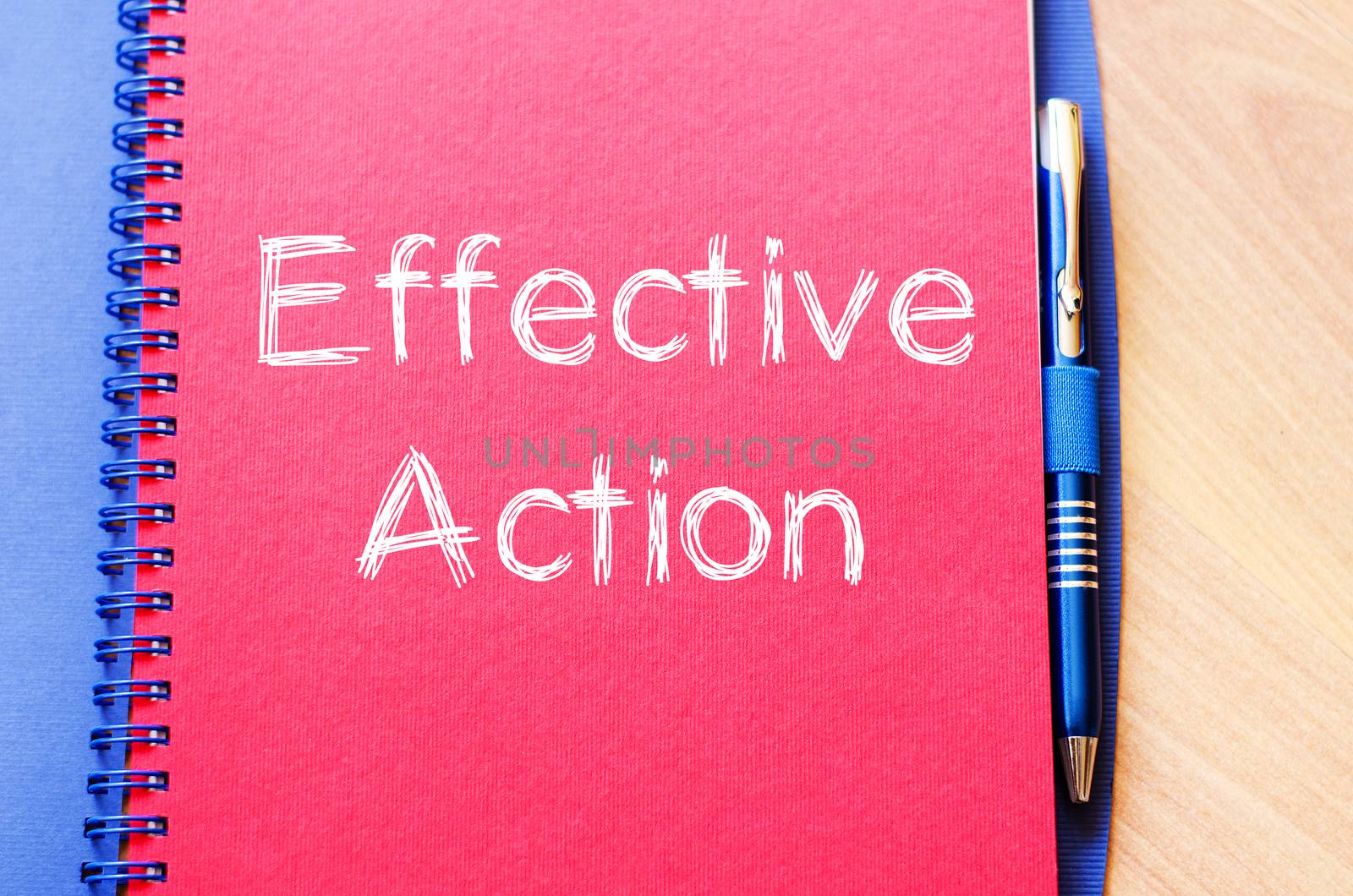 Effective action text concept write on notebook with pen