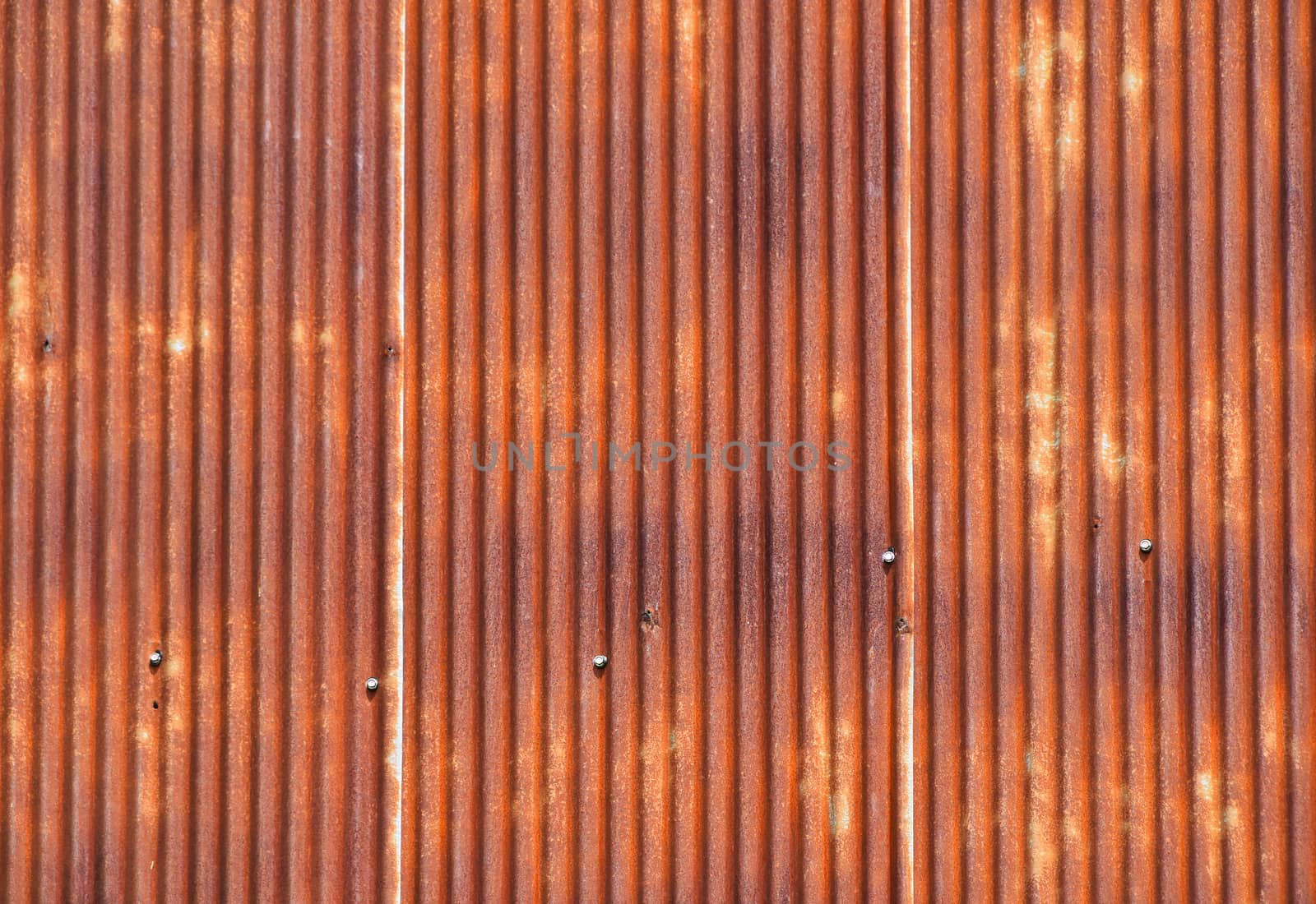 Old vintage bright rusty stained corroded metal goffered surface