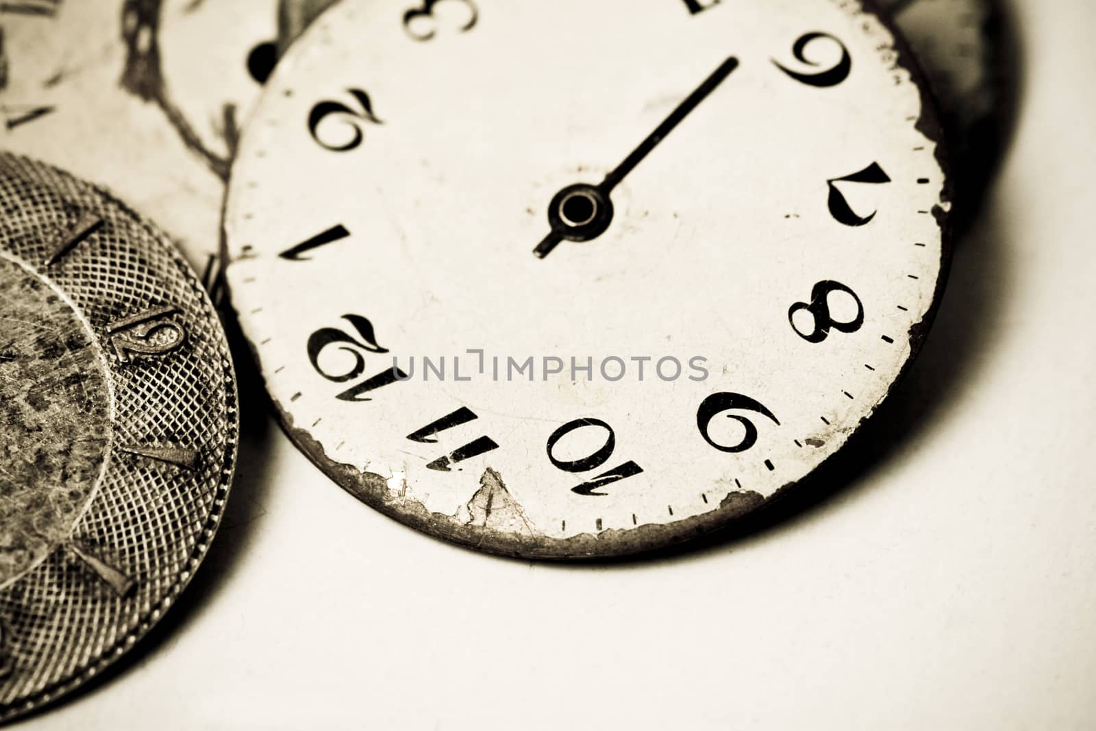 Horizontal high contrast top view of a set broken hand watches 