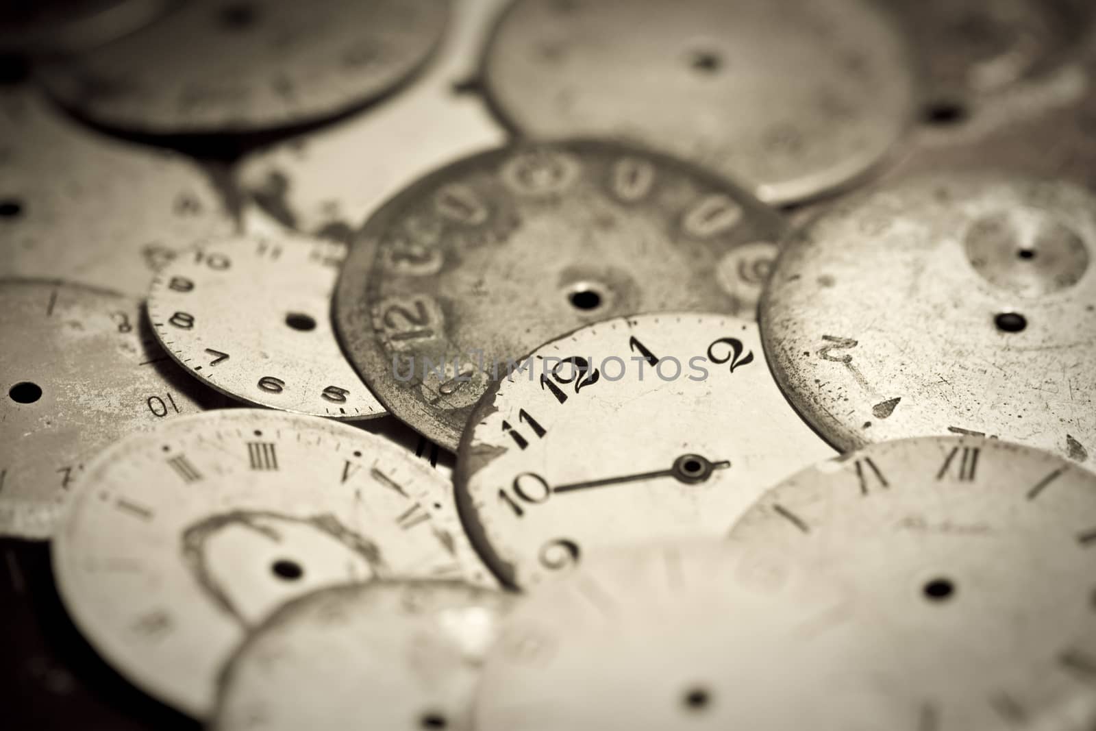Horizontal top view of a set broken hand watches 