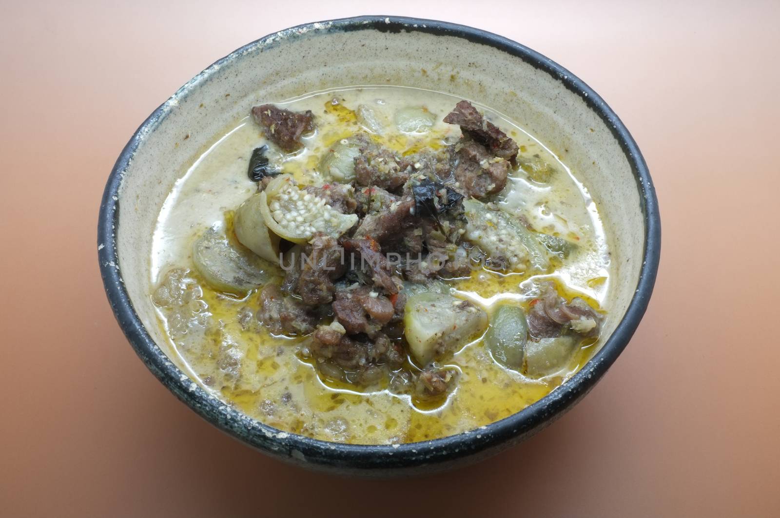 Thai green curry soup with beef and coconut milk