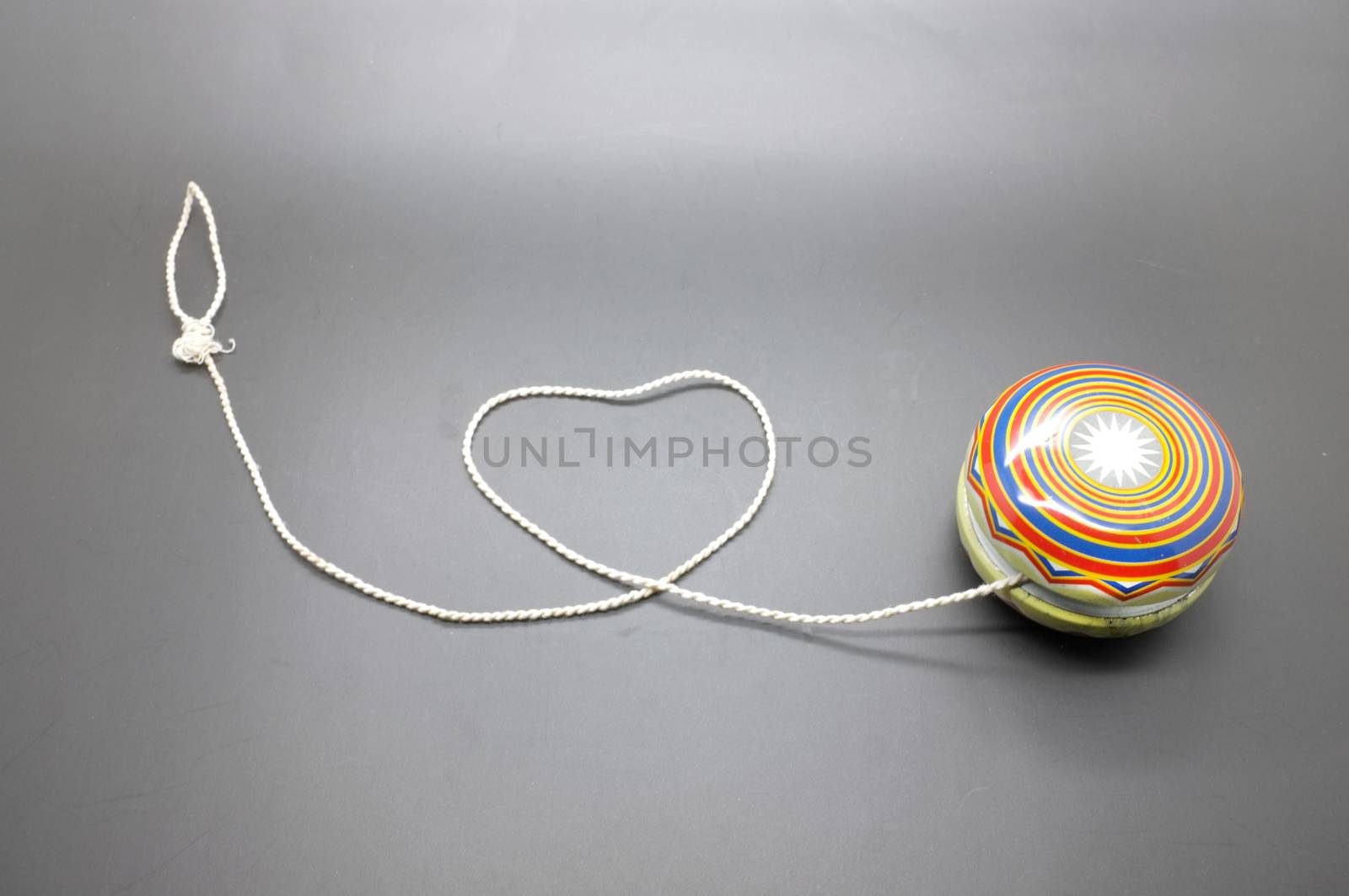 Vintage yoyo with twine rolling in heart shape
