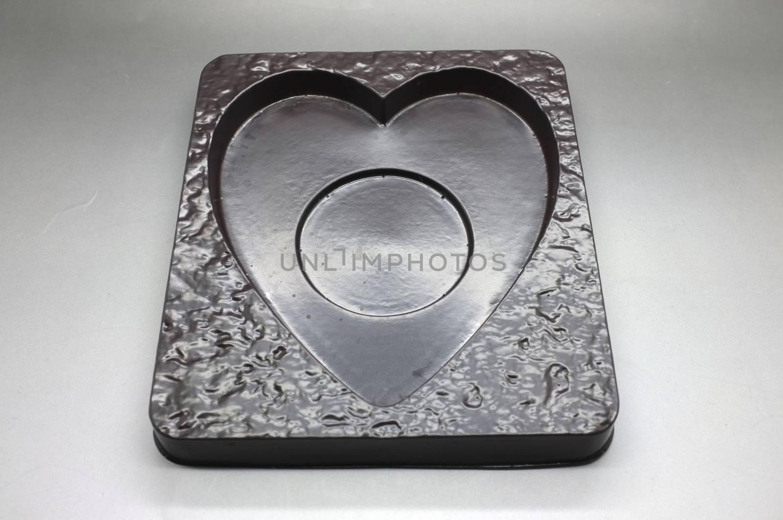 Empty plastic tray in heart shape