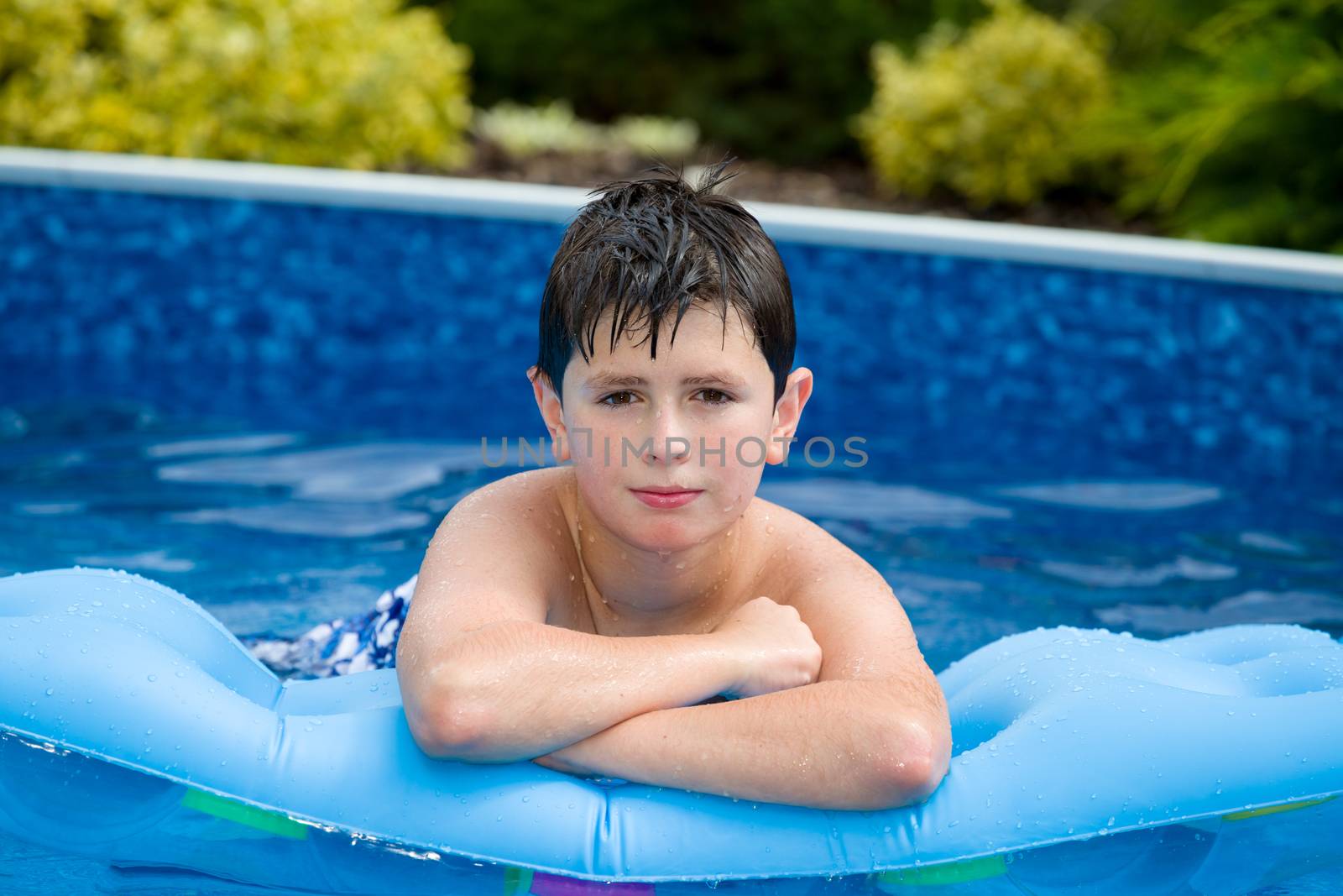 Boy in swimming pool by artush