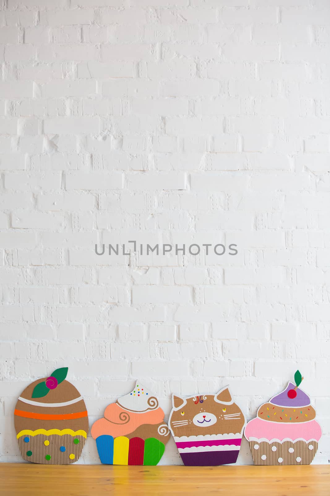 colored cakes handmade of cardboar on white background