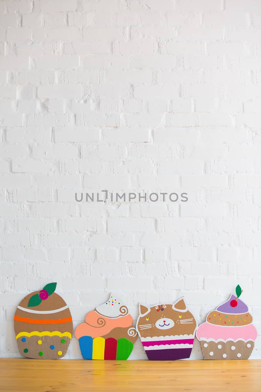 colored cakes handmade of cardboar on white background