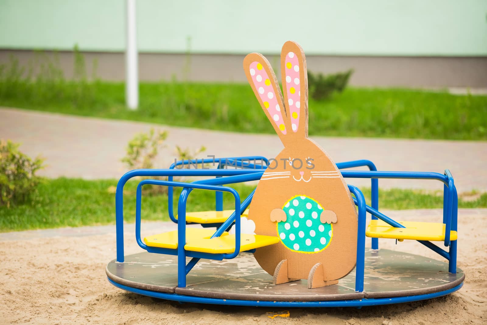 Decoration for Easter. Rabbit of cardboard in spring park