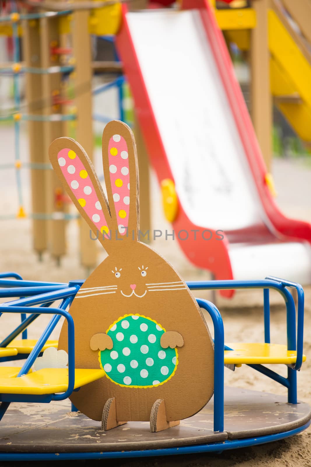Decoration for Easter. Rabbit of cardboard in spring park