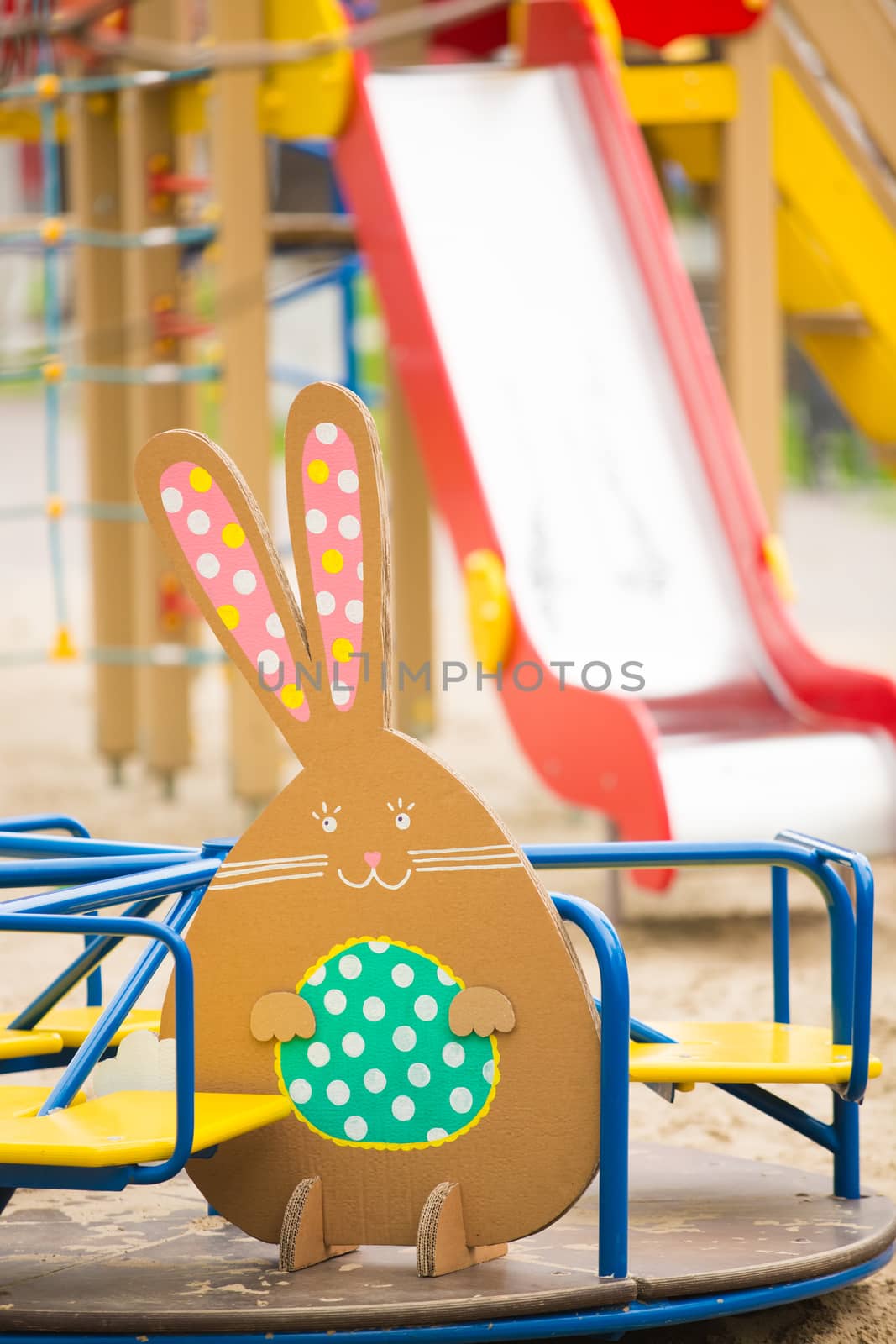 Decoration for Easter. Rabbit of cardboard in spring park