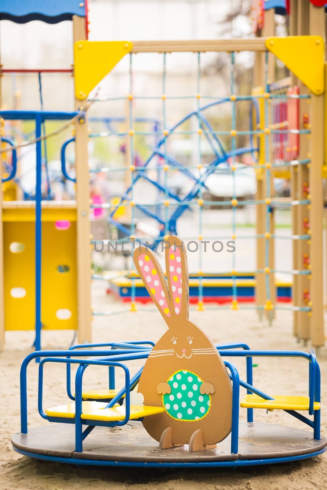 Decoration for Easter. Rabbit of cardboard in spring park