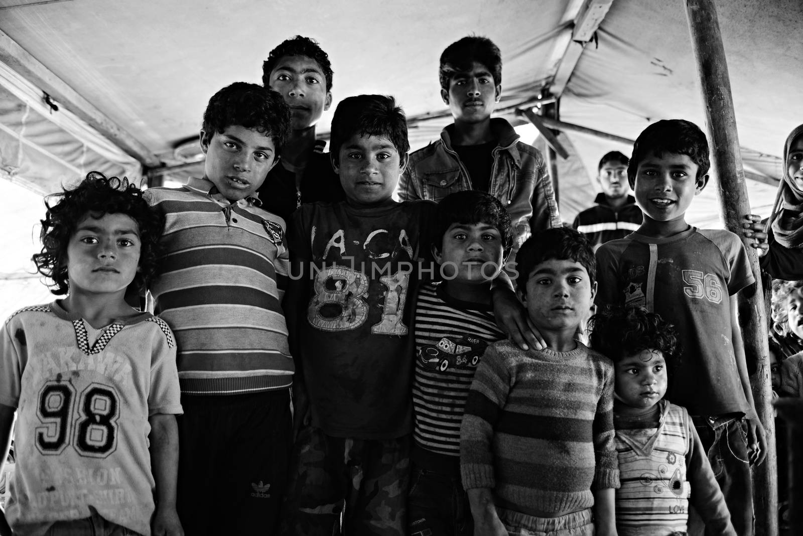 Unnamed  syrian people in unofficial refugee camp in Reayhanli. These people are refugees from Syria and escaped because of long civil war. April 1, 2015; Reyhanli, Turkey