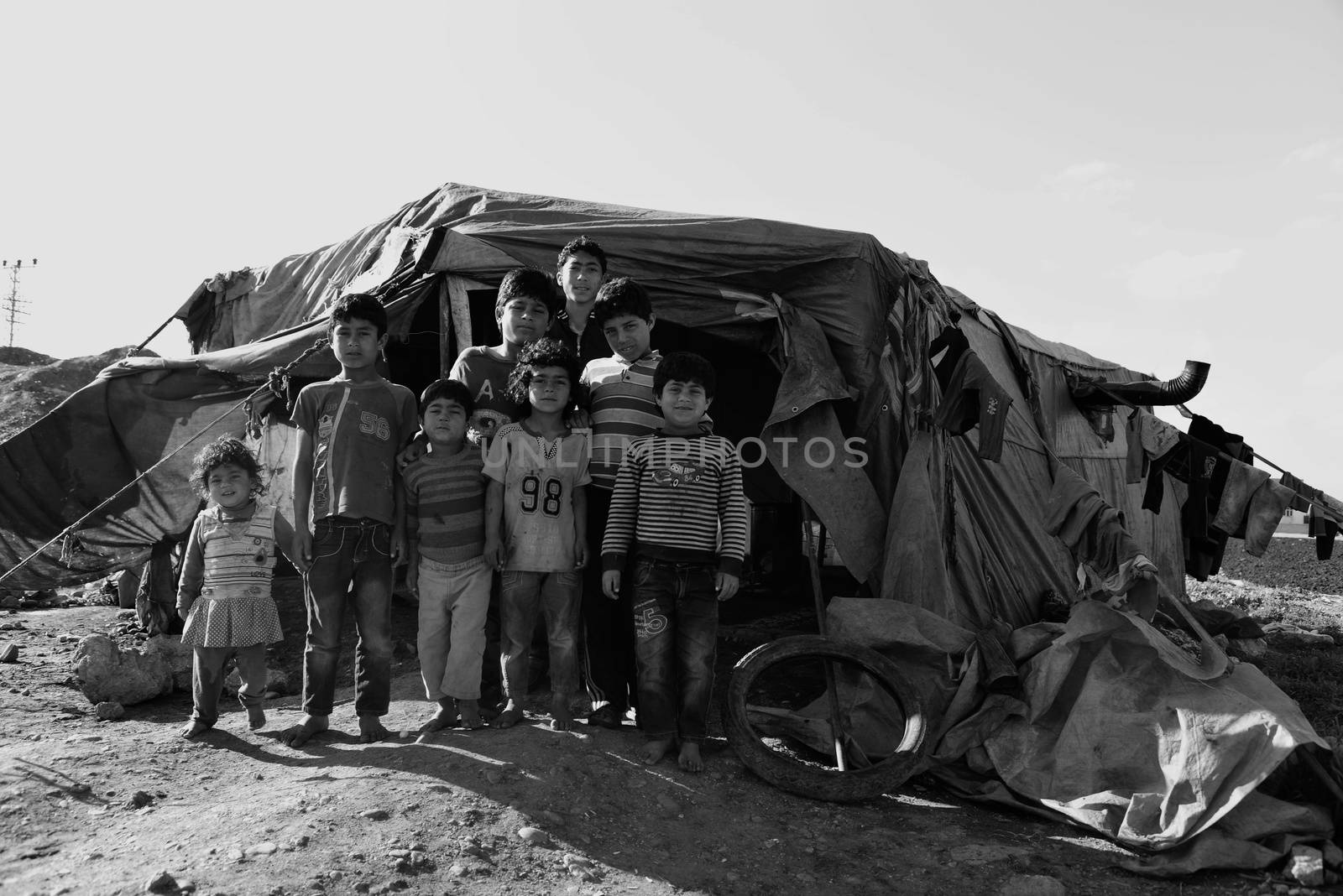 Unnamed  syrian people in unofficial refugee camp in Reayhanli. These people are refugees from Syria and escaped because of long civil war. April 1, 2015; Reyhanli, Turkey
