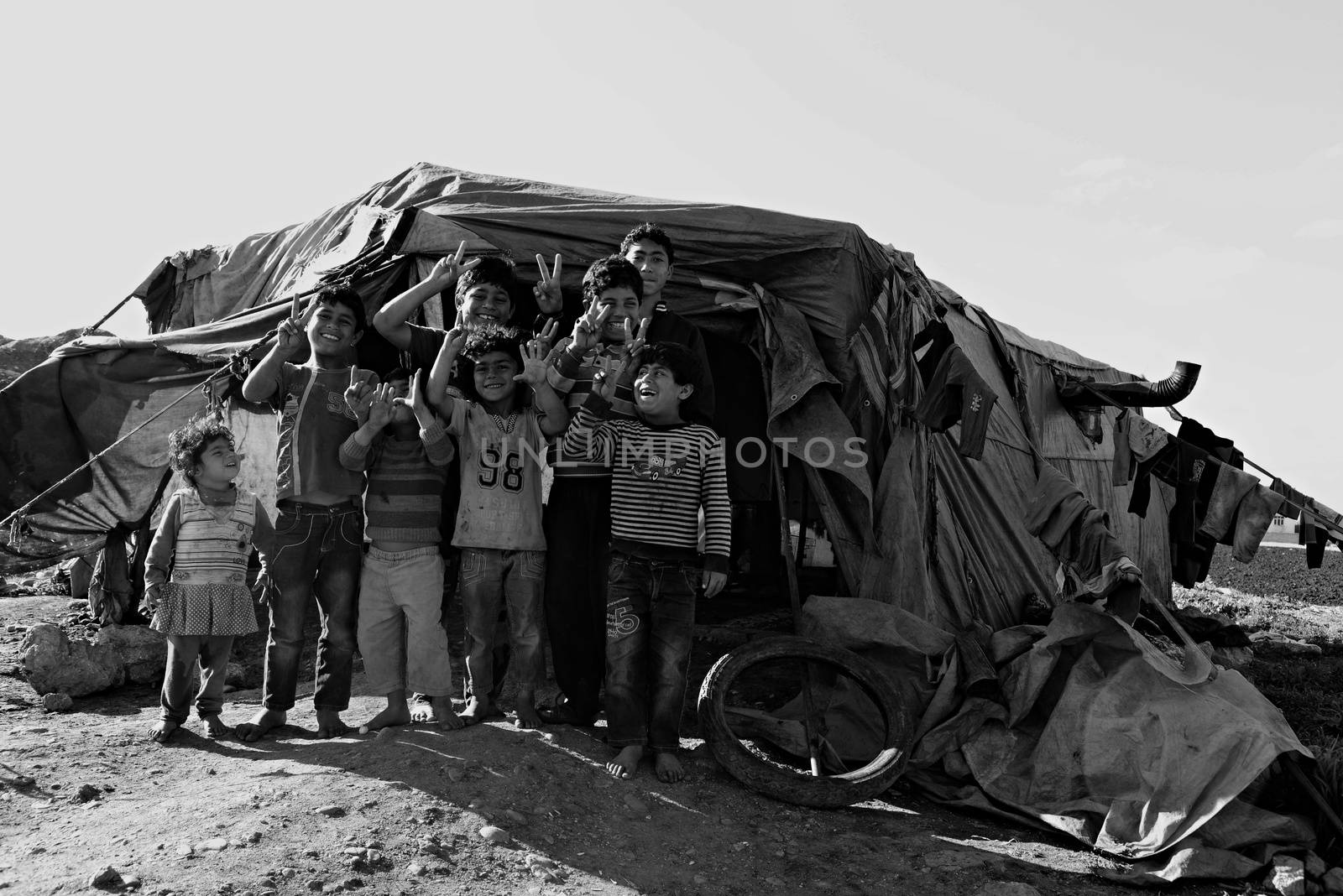 Unnamed  syrian people in unofficial refugee camp in Reayhanli. These people are refugees from Syria and escaped because of long civil war. April 1, 2015; Reyhanli, Turkey