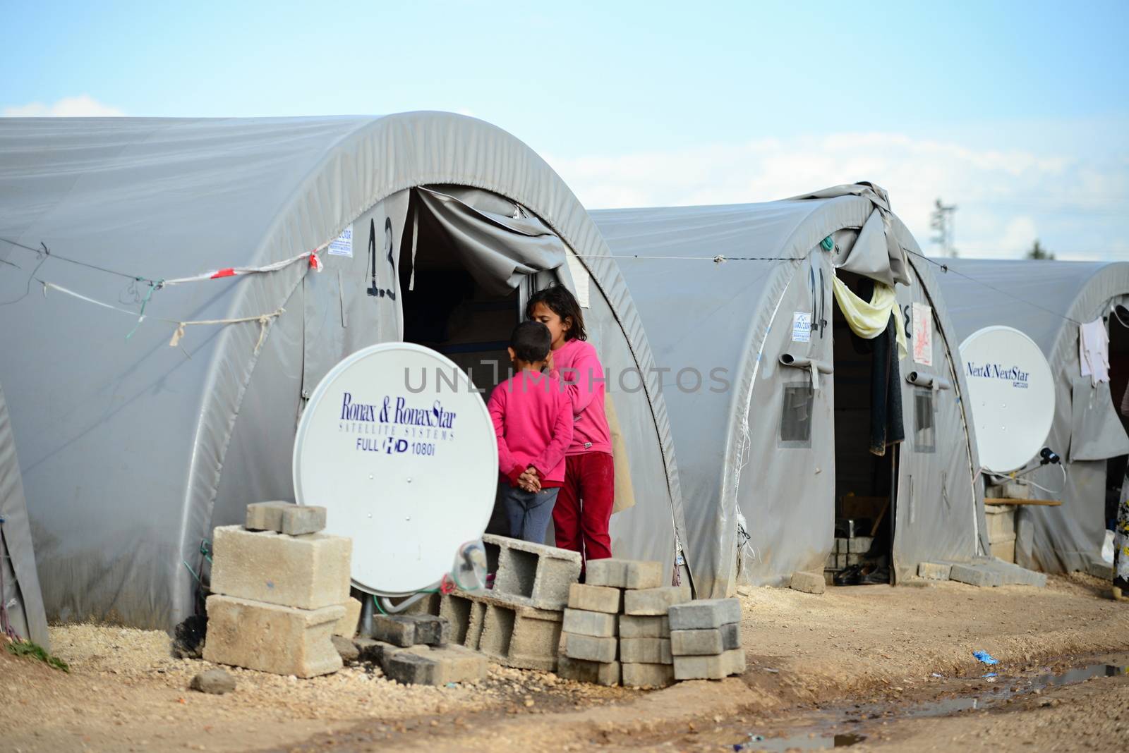 Unnamed  syrian (kurdish) people in refugee camp in Suruc. These people are refugees from Kobane and escaped because of Islamic state attack. April 3, 2015; Suruc, Turkey