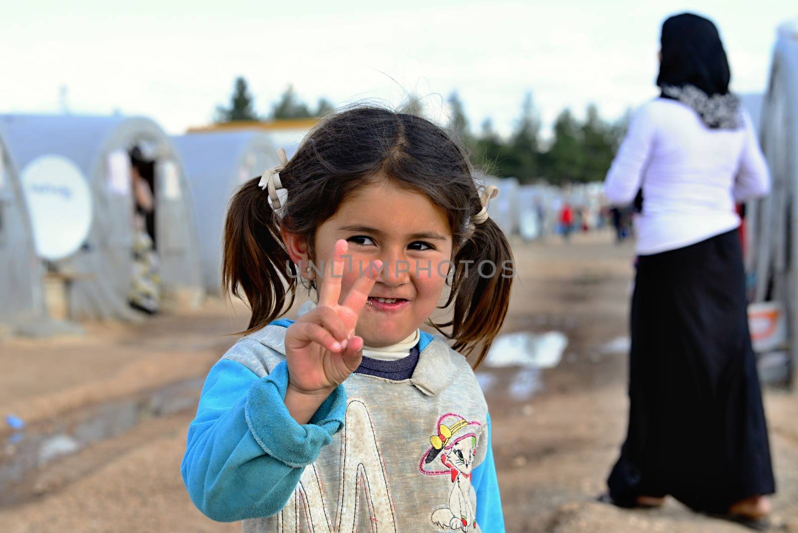 Syrian people in refugee camp in Suruc. These people are refugees from Kobane and escaped because of Islamic state attack. 3.4.2015, Suruc, Turkey