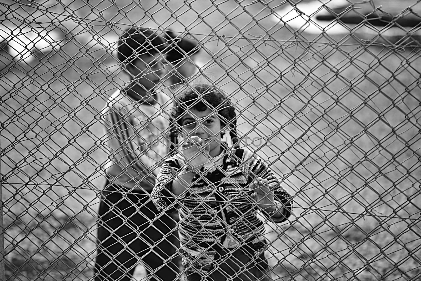 people in refugee camp by radekprocyk