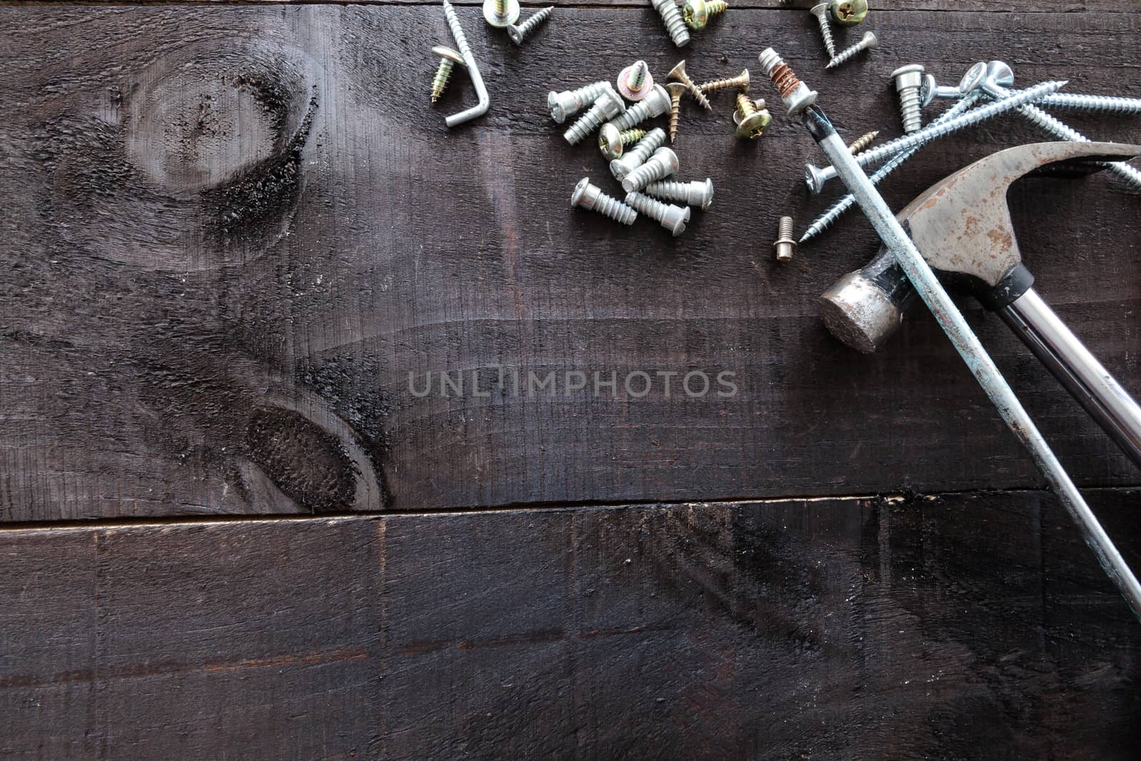 Still life containing several tools in dark wood background