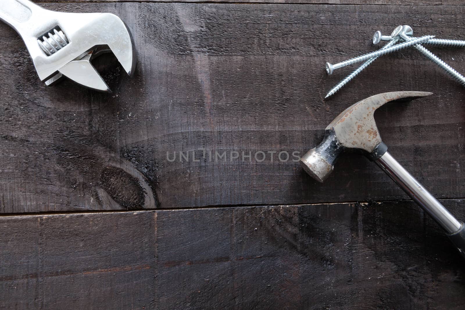 Still life containing several tools in dark wood background