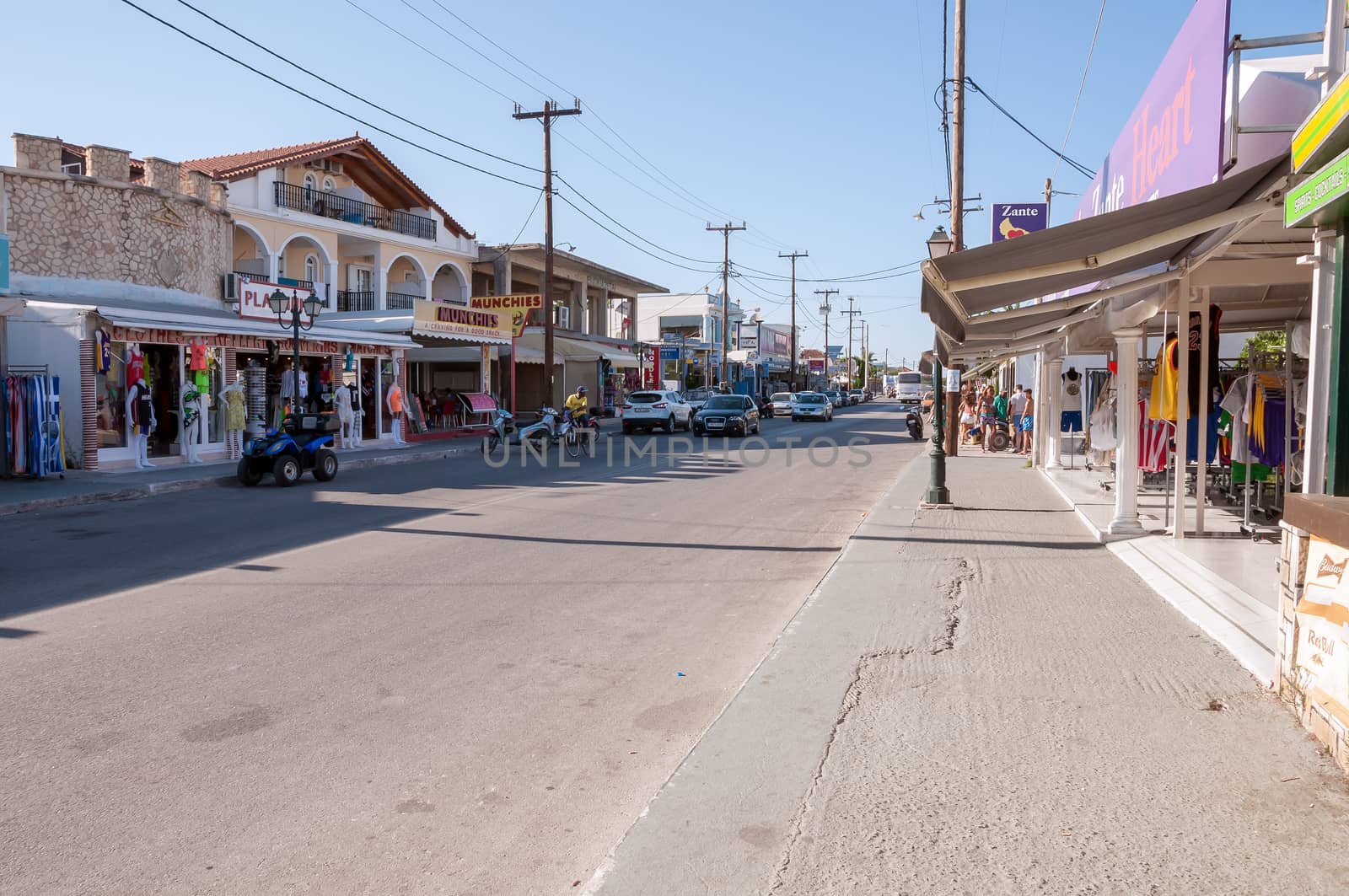 Zakynthos, Greece - August 28, 2015: Main street of Lagas town. It is a very popular holidays destination full of clubs, bars and restaurants.