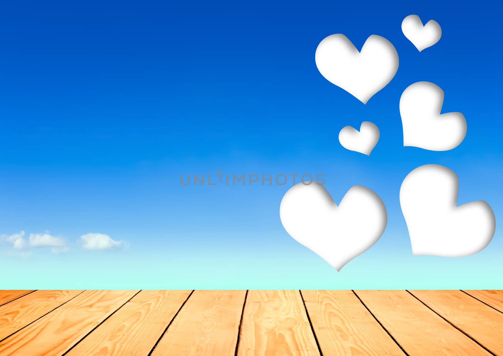 wood heart in the blue sky background