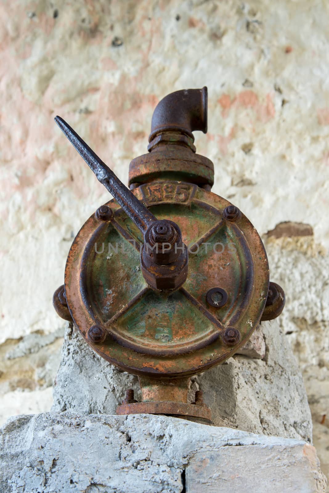 authentic old rusty faucet in a water column
