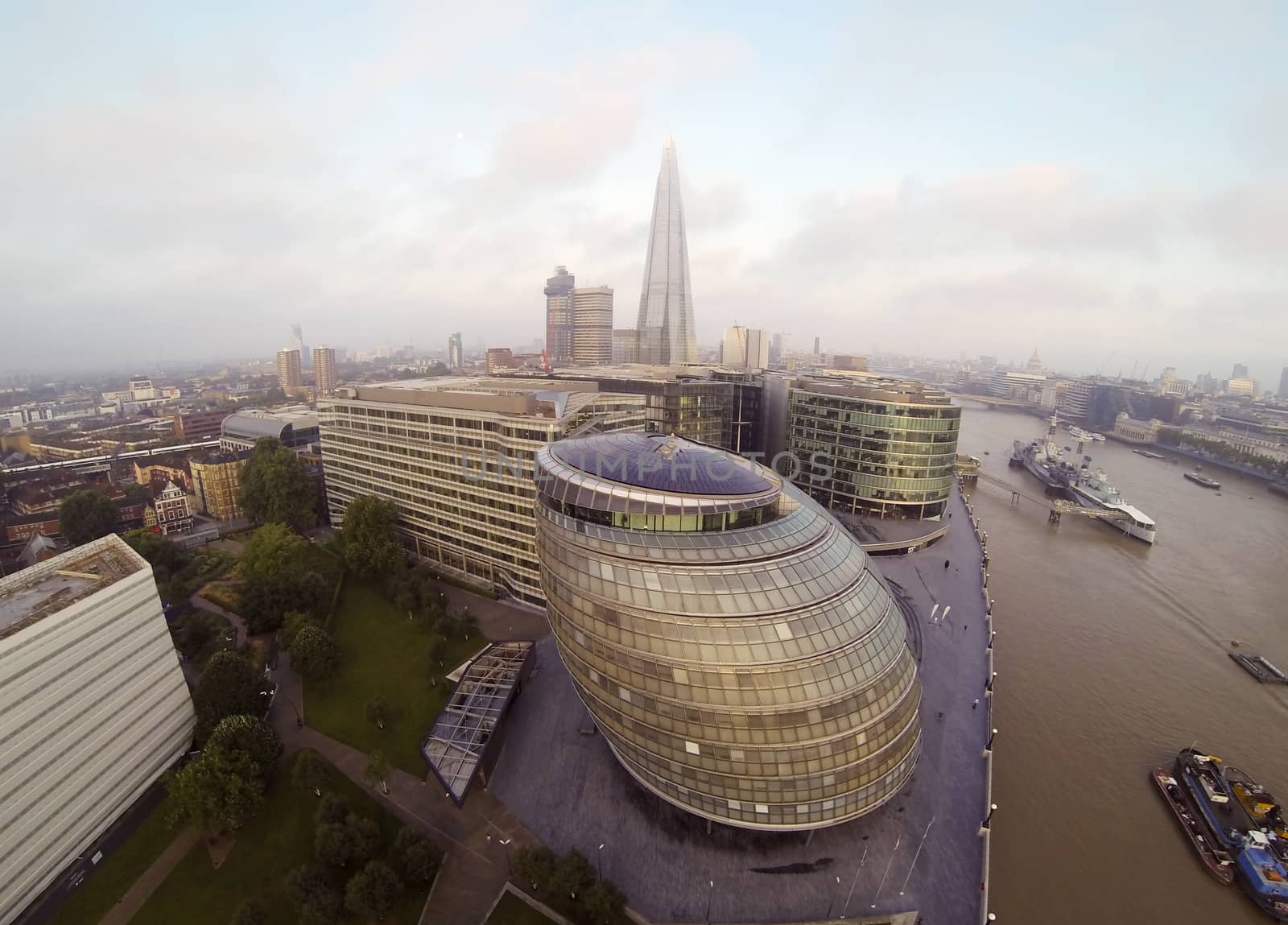 Aeral view on Thames river. The London City Hall in front and Leadenhal Building in the distance.