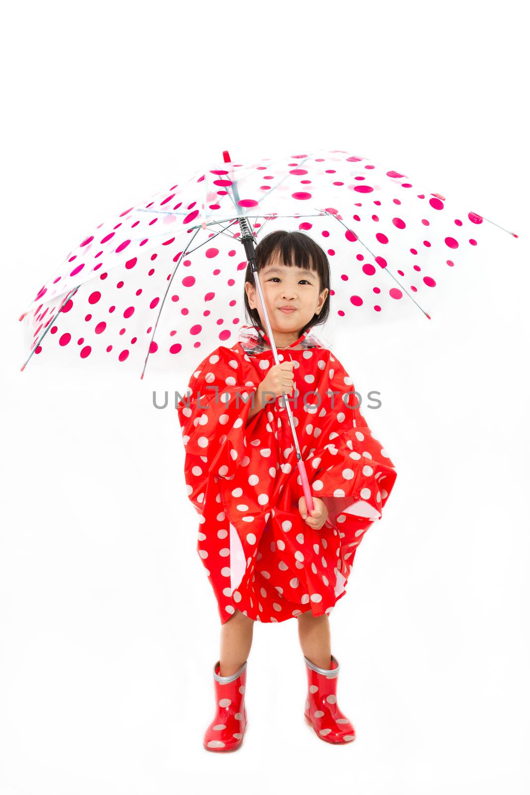 Chinese Little Girl Holding umbrella with raincoat in plain white isolated background.