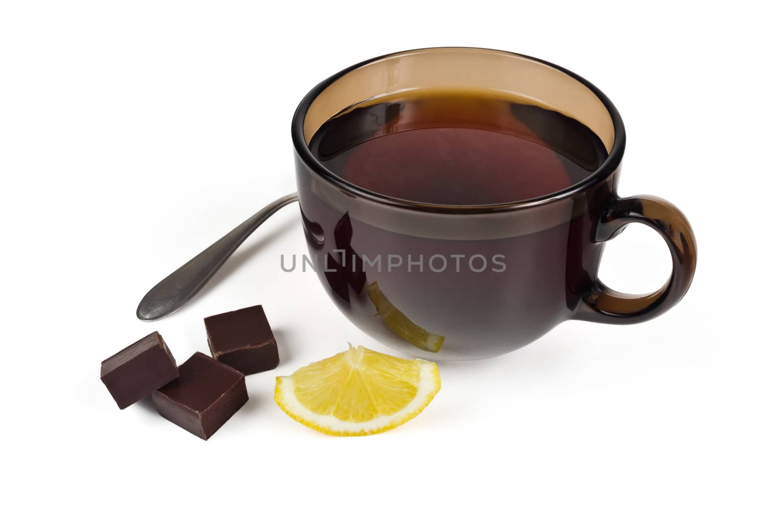 A cup of tea, chocolate and a slice of lemon on a white background