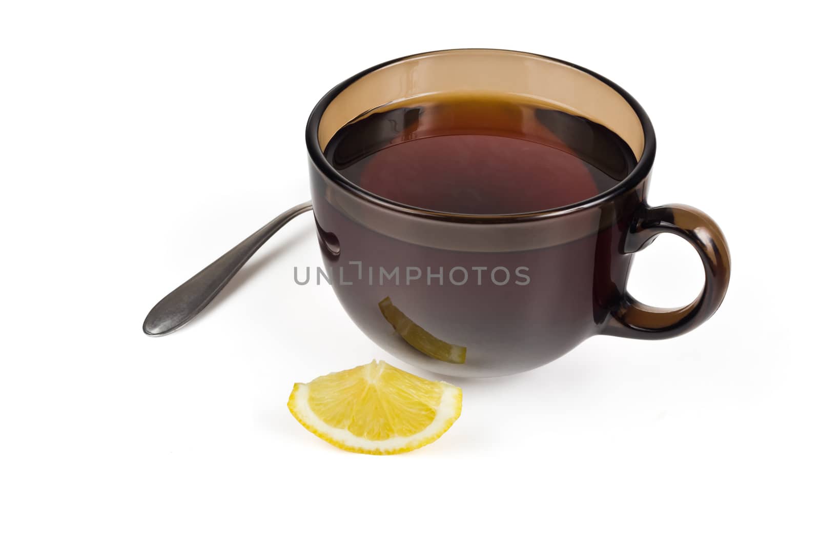 A cup of tea, and a slice of lemon on a white background